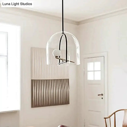 Modern clear glass cylinder pendant light with black frame for living room on Tampa Home & Garden Store