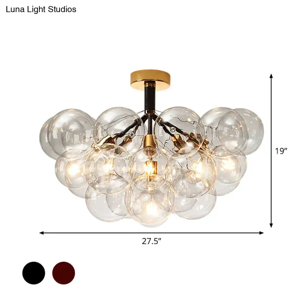 Brass Black Bubble Light chandelier with clear glass globe shades and gold hardware on Tampa Home & Garden Store