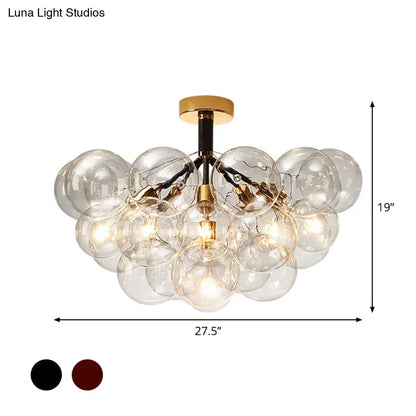 Brass Black Bubble Light chandelier with clear glass globe shades and gold hardware on Tampa Home & Garden Store