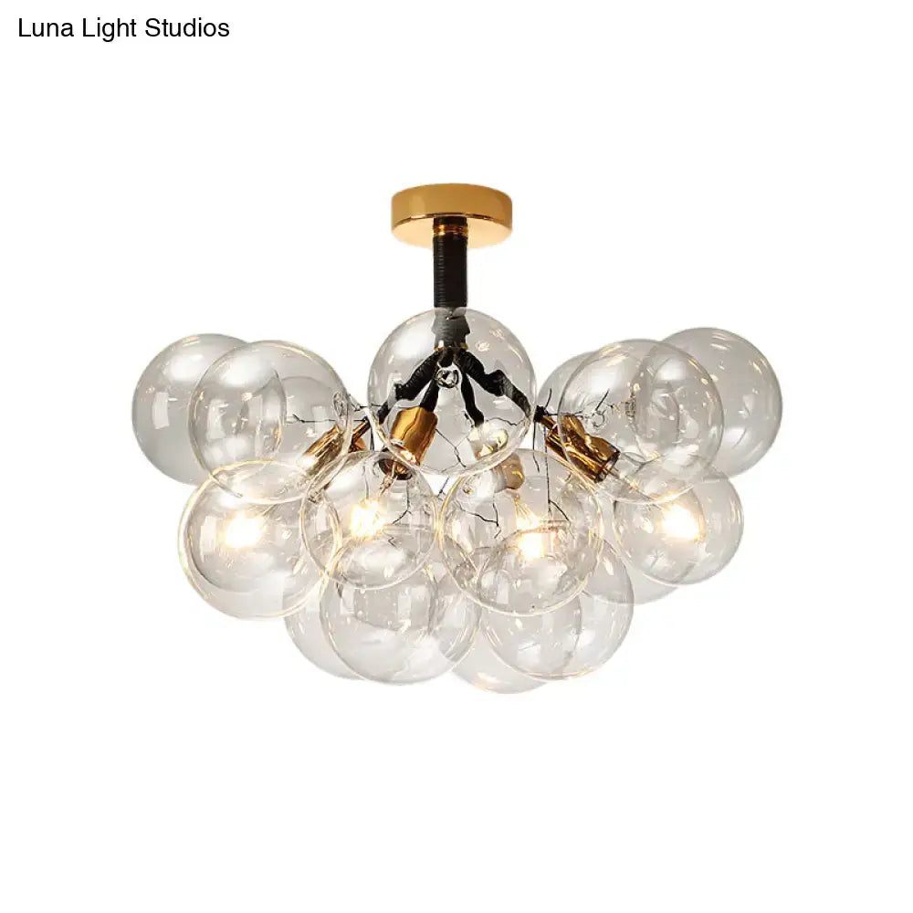Brass Black Bubble Light chandelier with a cluster of clear glass globes by Decorbites on Tampa Home & Garden Store