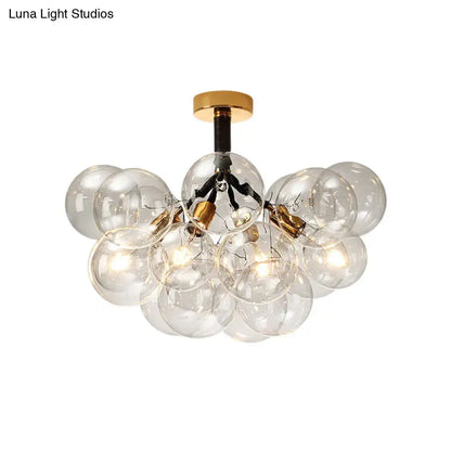 Brass Black Bubble Light chandelier with a cluster of clear glass globes by Decorbites on Tampa Home & Garden Store