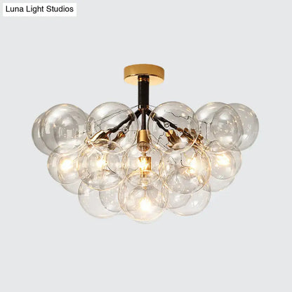 Brass Black Bubble Light chandelier with clear glass globe bulbs by Decorbites on Tampa Home & Garden Store