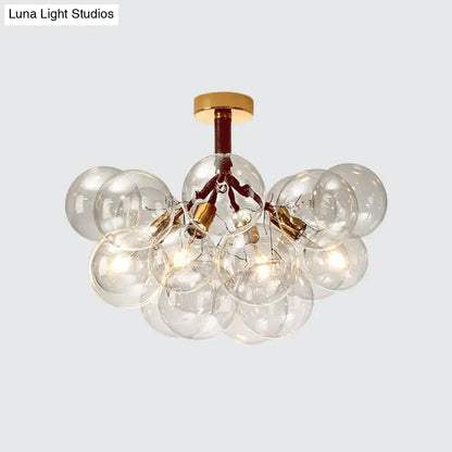 Decorbites Brass Black Bubble Light chandelier with clear glass globes on Tampa Home & Garden Store