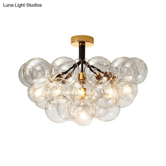 Brass black bubble light fixture with clear glass globes by Decorbites on Tampa Home & Garden Store
