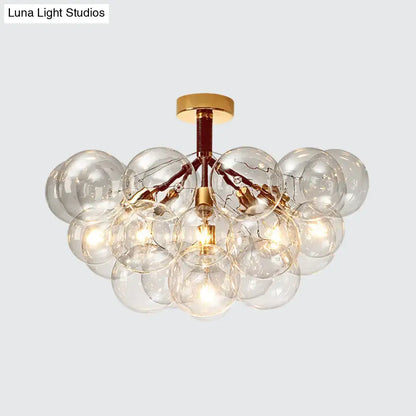 Brass Bubble Light chandelier with clear glass globes and gold hardware by Decorbites on Tampa Home & Garden Store