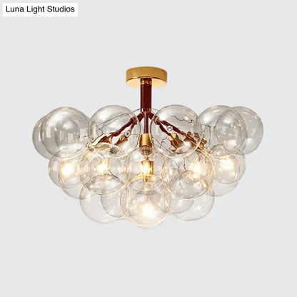 Decorbites brass bubble light fixture with clear glass globes, ceiling mount on Tampa Home & Garden Store