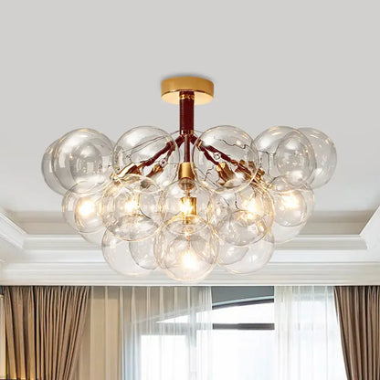 Brass Black Bubble Light chandelier with clear glass globes, brass canopy by Decorbites on Tampa Home & Garden Store