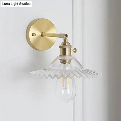 Brass glass compact industrial wall sconce with clear ribbed shade and Edison bulb on Tampa Home & Garden Store
