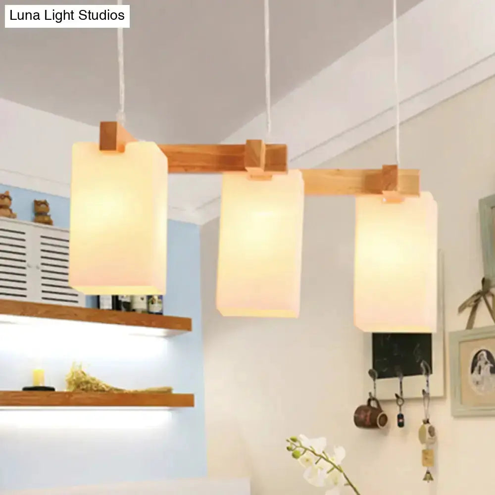 Wood and white glass cluster pendant light by Decorbites with 4 frosted shades and wood accents on Tampa Home & Garden Store