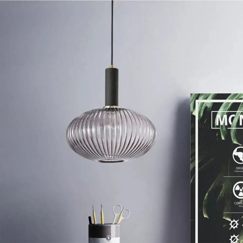Retro ribbed amber glass pendant light with black cord holder for dining room on Tampa Home & Garden Store