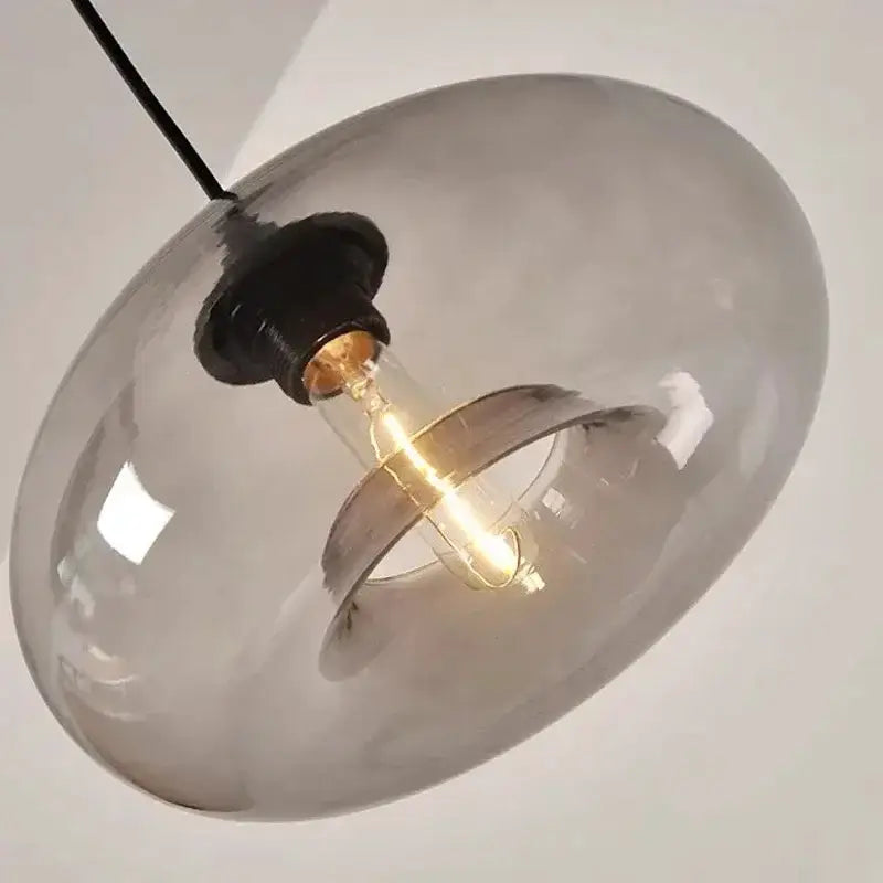 Pendant light Decorbites modern amber smoky gray glass dome with exposed filament bulb on Tampa Home & Garden Store