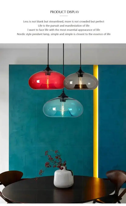 Glass pendant lights trio by Decorbites in red smoky gray and teal LED over round dining table on Tampa Home & Garden Store