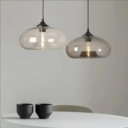 Pendant lights: two modern amber and smoky gray glass LED fixtures by Decorbites on Tampa Home & Garden Store
