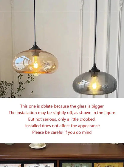 Pendant lights by Decorbites, two amber and smoky gray glass LED domes for dining room on Tampa Home & Garden Store