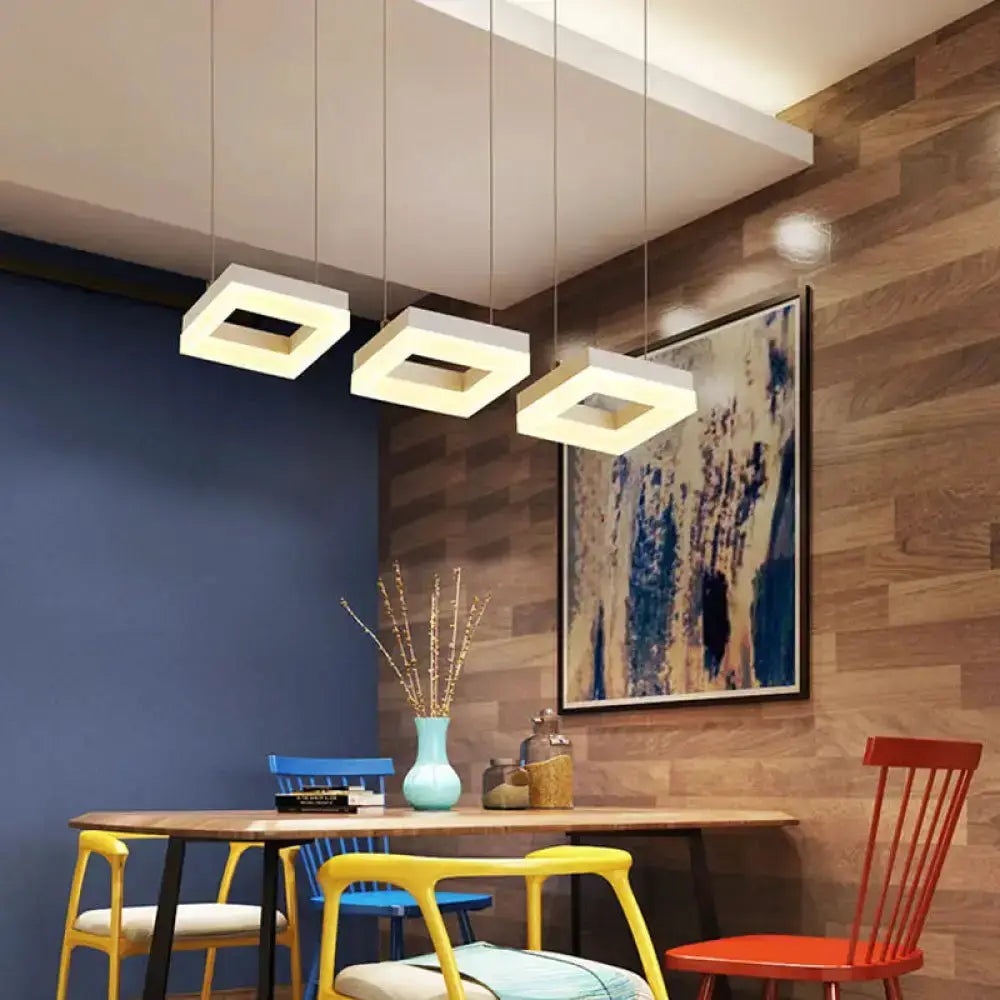 Modern silver acrylic kitchen pendant fixture by Decorbites with three frames over table on Tampa Home & Garden Store