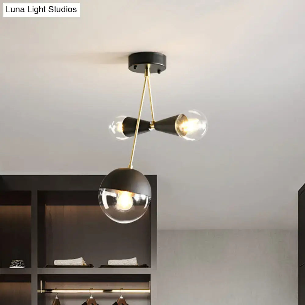 Black Glass Flush Mount light fixture, three globe bulbs, black metal with brass accents on Tampa Home & Garden Store