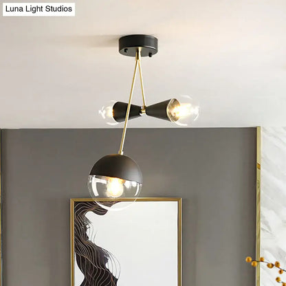 Black Glass Flush Mount by Decorbites with brass accents and clear glass globes, three-light on Tampa Home & Garden Store