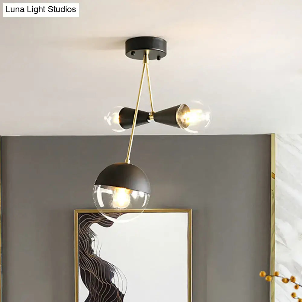 Decorbites black glass flush mount ceiling light with brass accents and three glass bulbs on Tampa Home & Garden Store