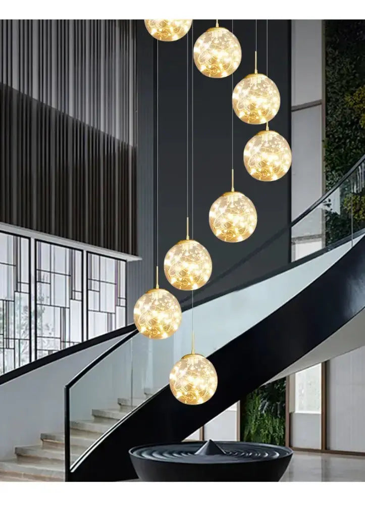 Modern spiral crystal ball chandelier dining room pendant light with gold orbs cascading on Tampa Home & Garden Store