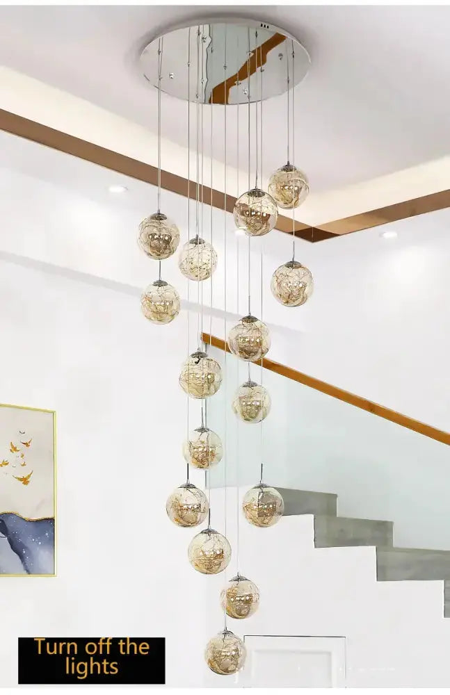 Chandelier Decorbites modern spiral crystal ball pendant light with gold glass spheres cascading from round ceiling mount on Tampa Home & Garden Store