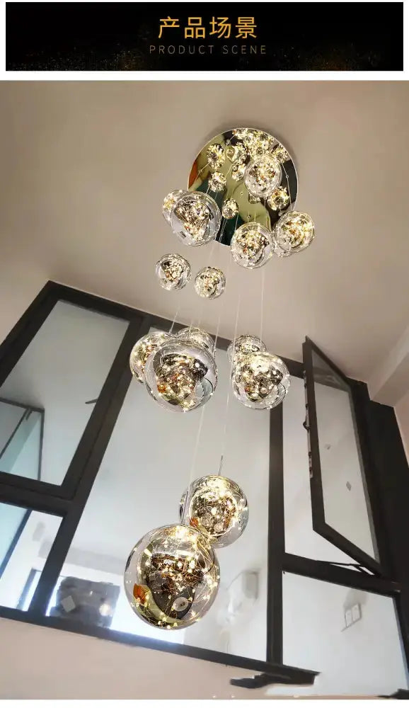 Modern spiral crystal ball chandelier with hanging glass orbs at varying heights Decorbites on Tampa Home & Garden Store