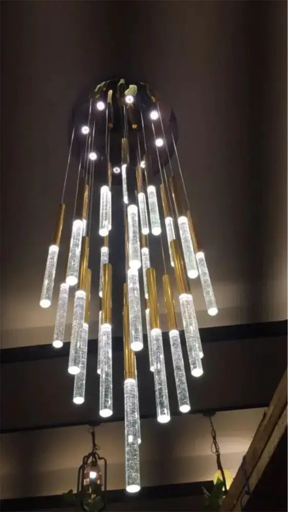 Modern gold crystal chandelier with large hanging rods, Decorbites staircase pendant light on Tampa Home & Garden Store