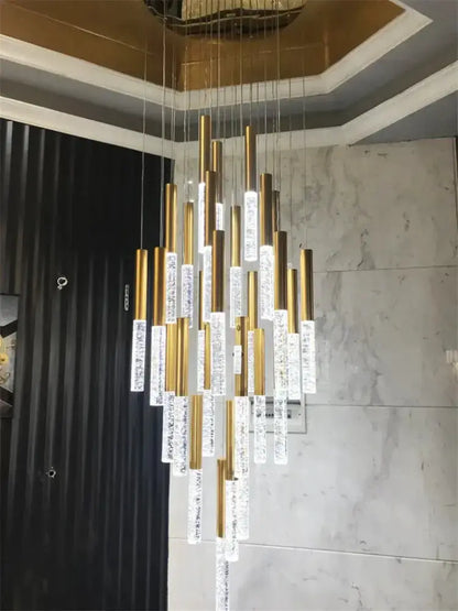 Modern gold crystal chandelier by Decorbites with cascading gold tubes and crystal prisms on Tampa Home & Garden Store