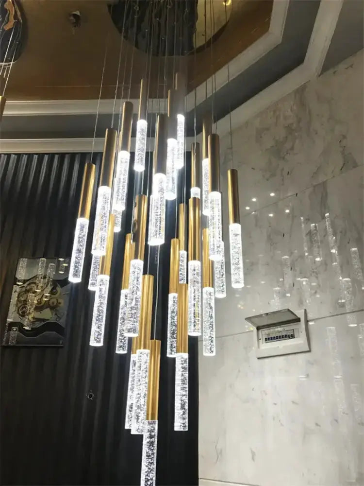 Modern gold crystal chandelier by Decorbites large staircase pendant light with crystal rods on Tampa Home & Garden Store