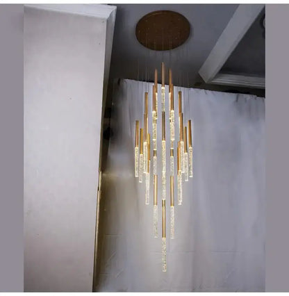 Modern gold crystal chandelier with cascading glass rods by Decorbites on Tampa Home & Garden Store