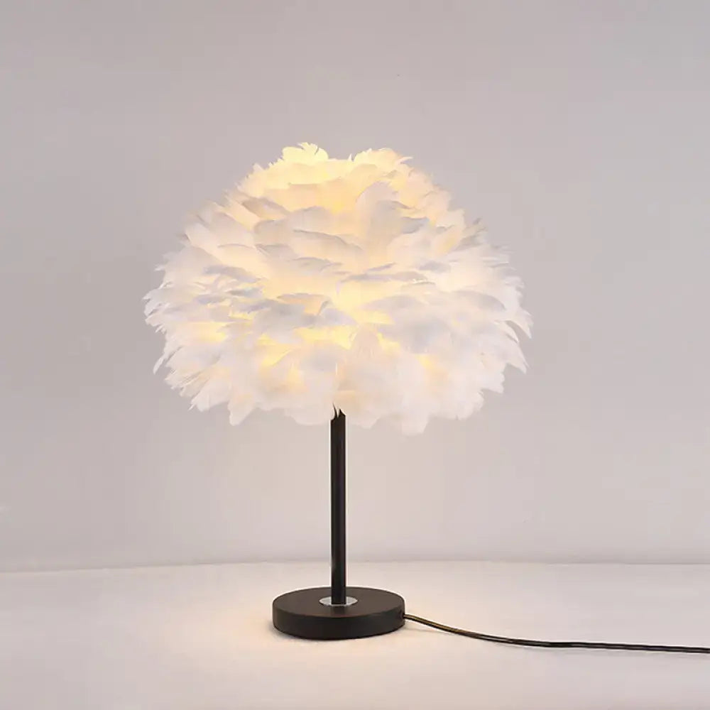 White Feather Flower Bedroom Table Lamp by Decorbites with a black metal base and warm glow on Tampa Home & Garden Store