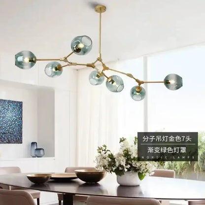 Modern teal glass bubble chandelier by Decorbites with brass arms and eight globes on Tampa Home & Garden Store