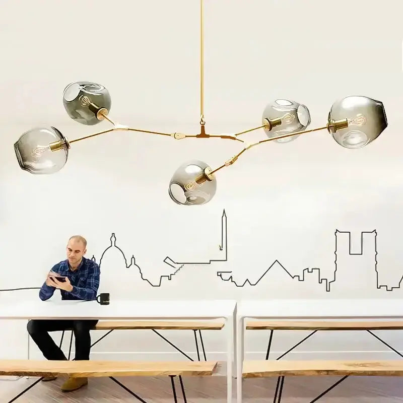 Modern teal glass bubble chandelier by Decorbites with eight globe lights and brass frame on Tampa Home & Garden Store