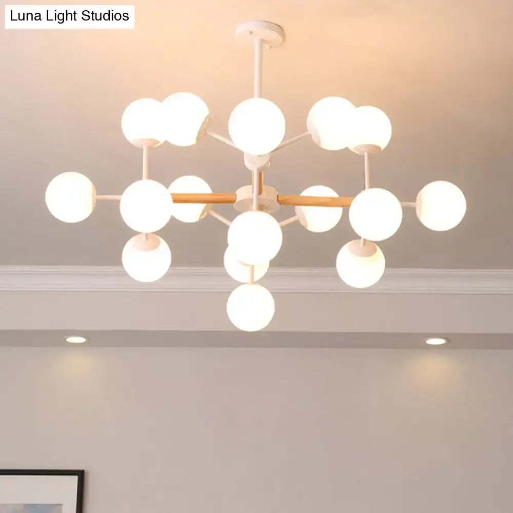White Globe Chandelier by Decorbites, white globe bulbs on a white metal frame with wood accent on Tampa Home & Garden Store