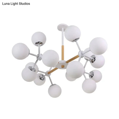 White globe chandelier by Decorbites with frosted glass globes on metal spokes on Tampa Home & Garden Store