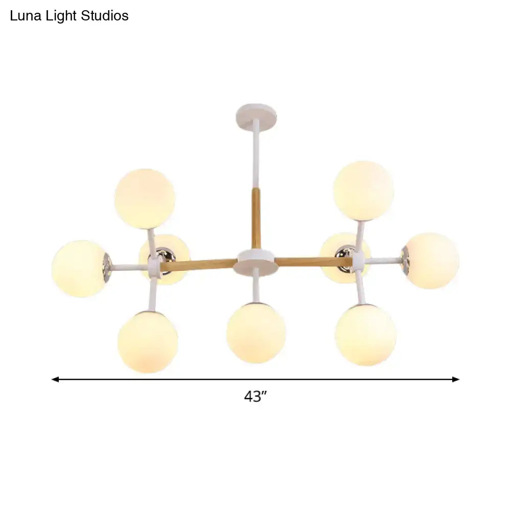White Globe Chandelier by Decorbites, eight frosted globes on a white-and-wood frame, 43in span on Tampa Home & Garden Store