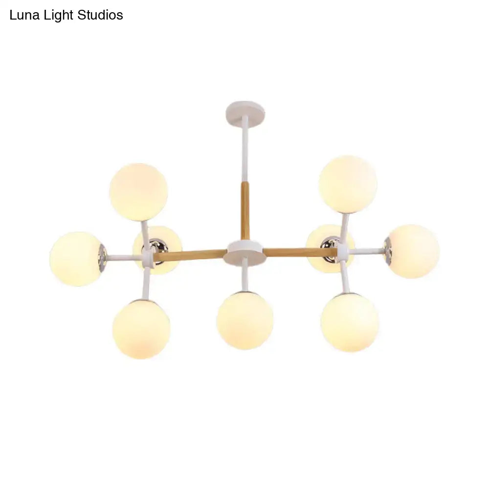White Globe Chandelier by Decorbites with wood-accent frame and eight white glass globes on Tampa Home & Garden Store