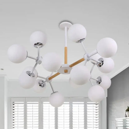 Decorbites White Globe Chandelier with white globe bulbs and metal arms on Tampa Home & Garden Store