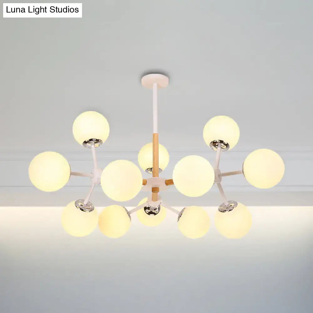 White Globe Chandelier with 12 frosted glass globes on white arms by Decorbites on Tampa Home & Garden Store