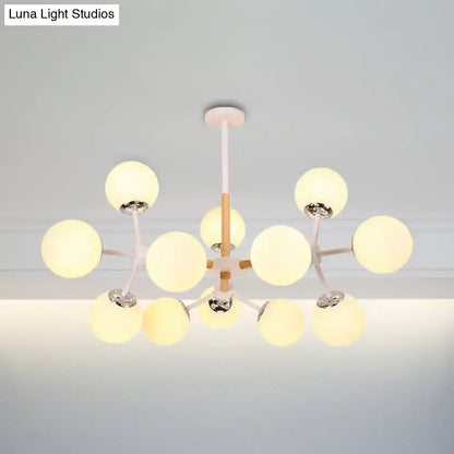 White Globe Chandelier with 12 frosted glass globes on white arms by Decorbites on Tampa Home & Garden Store