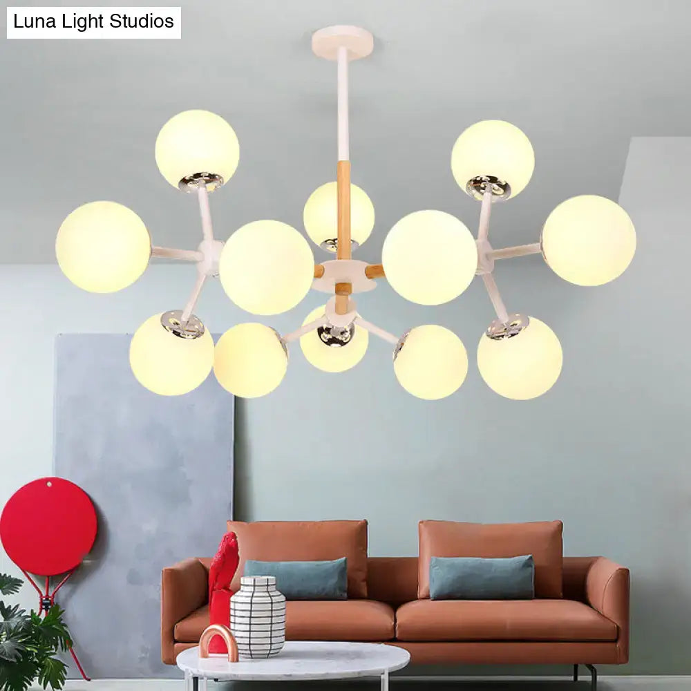 White globe chandelier by Decorbites with frosted globes and wood accents on Tampa Home & Garden Store