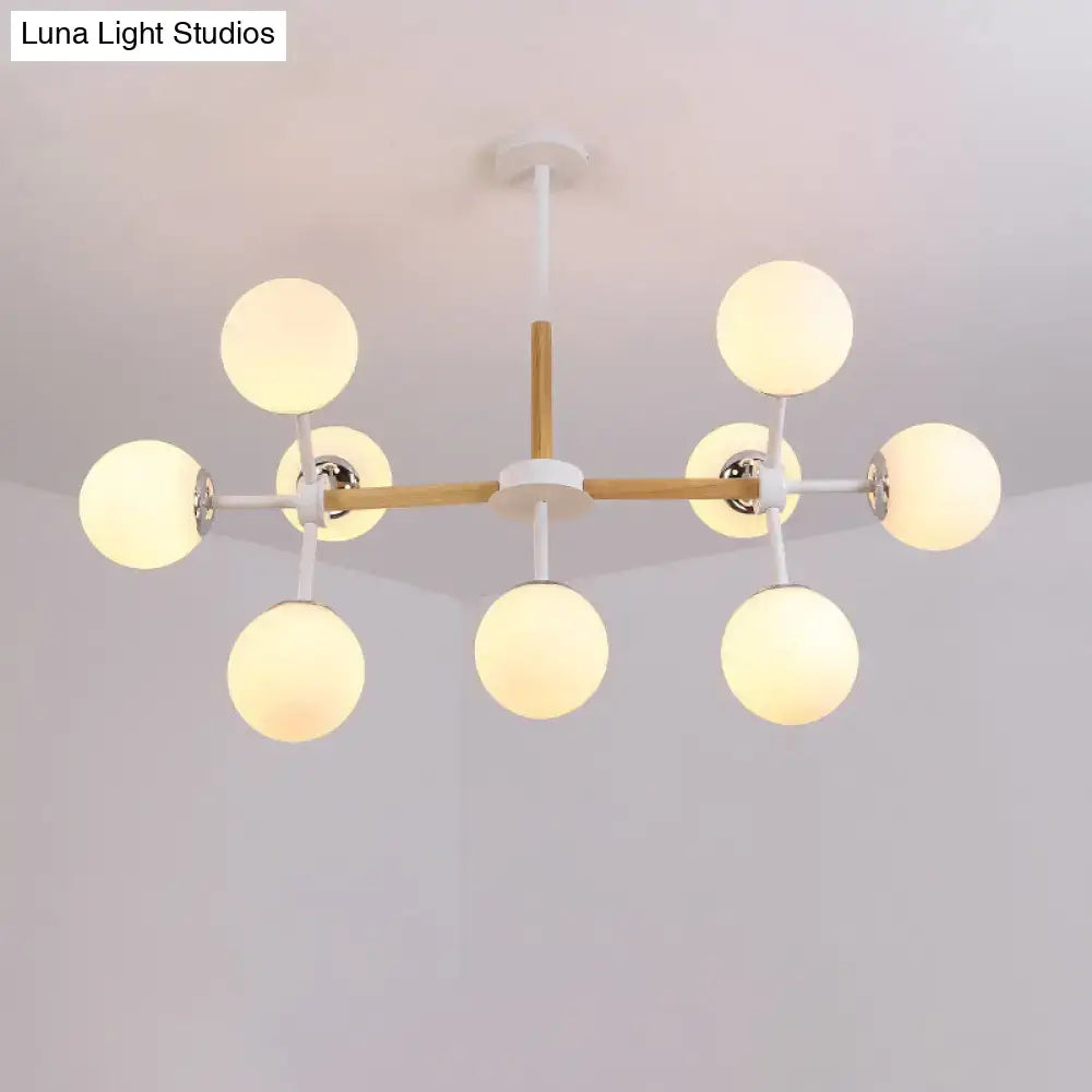 White Globe Chandelier with eight globes on wood and white metal arms by Decorbites on Tampa Home & Garden Store