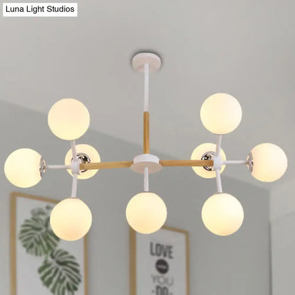 White Globe Chandelier with wood and white metal arms and frosted glass globes by Decorbites on Tampa Home & Garden Store