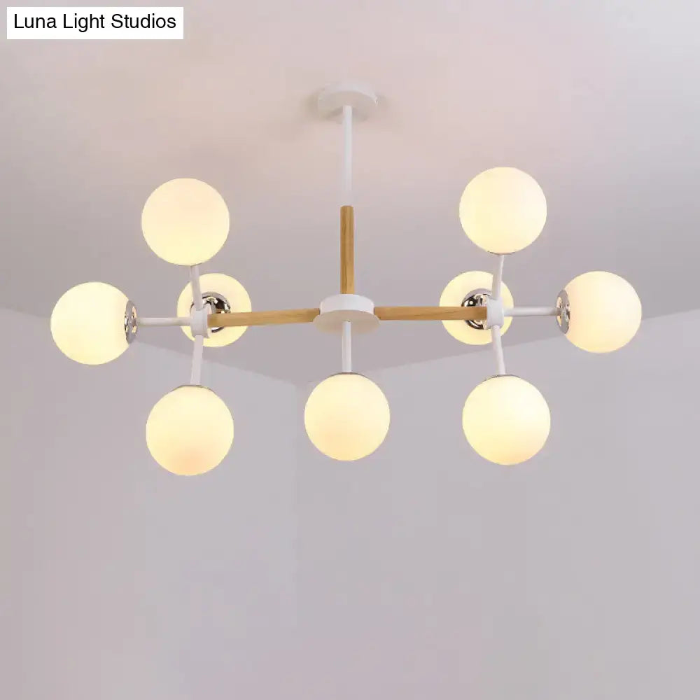 White Globe Chandelier by Decorbites with wood-accent arms and white globe bulbs, ceiling mount on Tampa Home & Garden Store