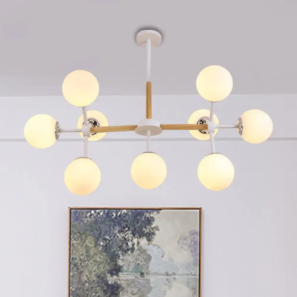 White Globe Chandelier by Decorbites with wood-accent frame and warm frosted globe bulbs on Tampa Home & Garden Store