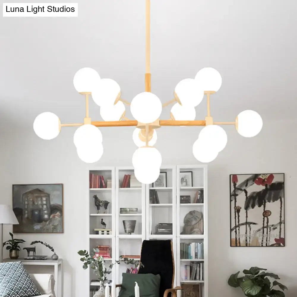 White Globe Chandelier by Decorbites with wooden arms and multiple globe bulbs on Tampa Home & Garden Store