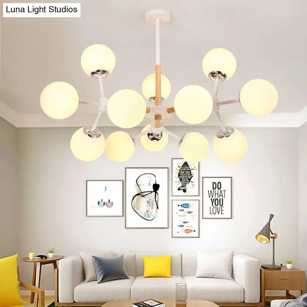 White Globe Chandelier by Decorbites with white globe lights and wood-accented center on Tampa Home & Garden Store