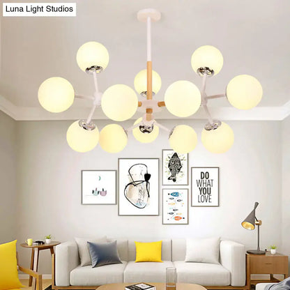 White Globe Chandelier by Decorbites with white globe lights and wood-accented center on Tampa Home & Garden Store