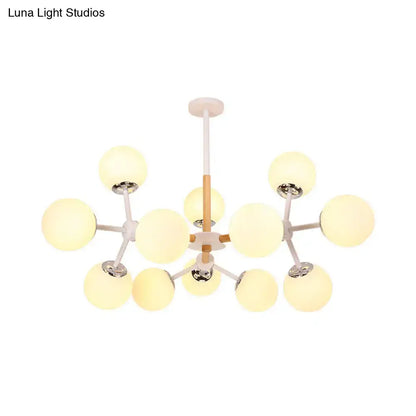 White globe chandelier by Decorbites with frosted glass globes, multi-arm design on Tampa Home & Garden Store