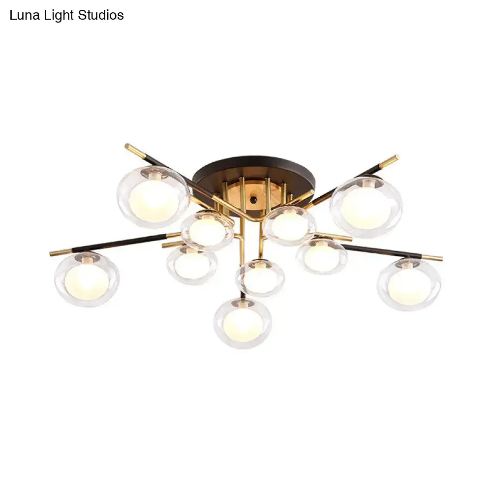 Gold oval glass light fixture with clear glass globes on brass arms on Tampa Home & Garden Store