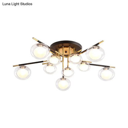 Gold oval glass light fixture with clear glass globes on brass arms on Tampa Home & Garden Store